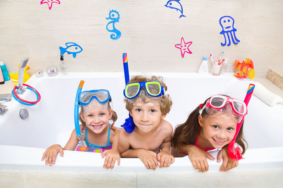 kids playing in tub with toys